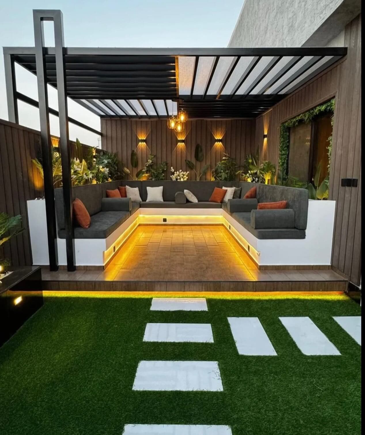 Contemporary Zanzibar residence design with broad windows and a planted garden