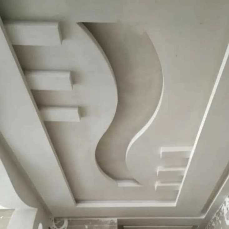 Curved recessed ceiling detail with a soft, indirect finish