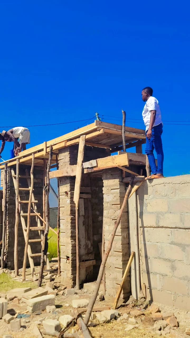 Builders working on the roof structure of a home
